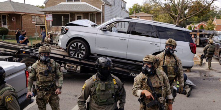 Police clash with community members after detaining a man on Chicago's South Side