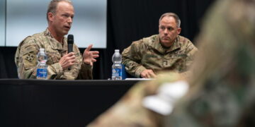 U.S. Army Lt. Gen. John Kolasheski and U.S. Army Maj. Gen. Christopher LaNeve speak with reporters in Poland near the Ukra...