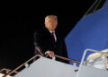 U.S. President Donald Trump boards Air Force One as he departs for Asia, at Joint Base Andrews