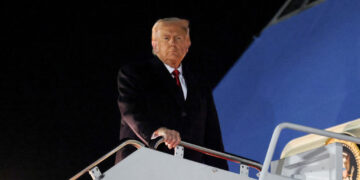 U.S. President Donald Trump boards Air Force One as he departs for Asia, at Joint Base Andrews