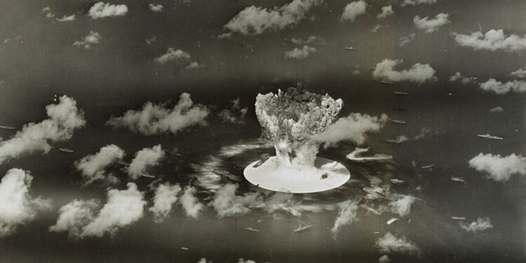 FILE PHOTO: Handout of a mushroom cloud rises with ships below during Operation Crossroads nuclear weapons test on Bikini ...