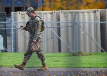 Members of the 49th Military Police Brigade from California at the Oregon Army National Guard's Camp Withycombe, in Happy ...