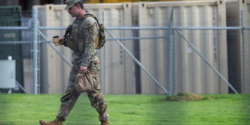 Members of the 49th Military Police Brigade from California at the Oregon Army National Guard's Camp Withycombe, in Happy ...