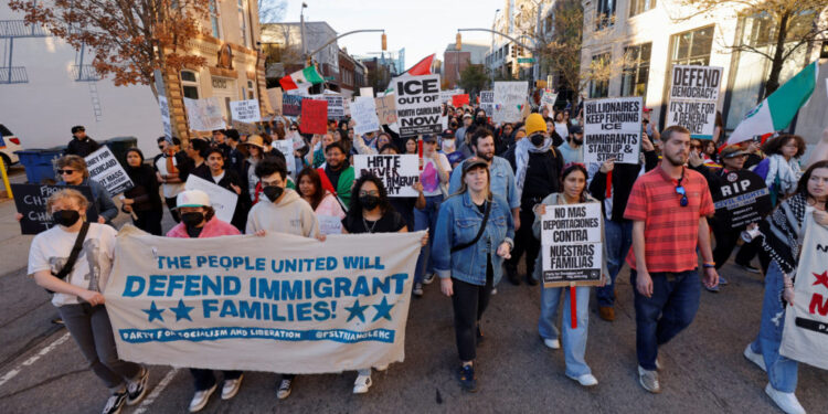 People protest as federal immigration authorities conduct raids in North Carolina