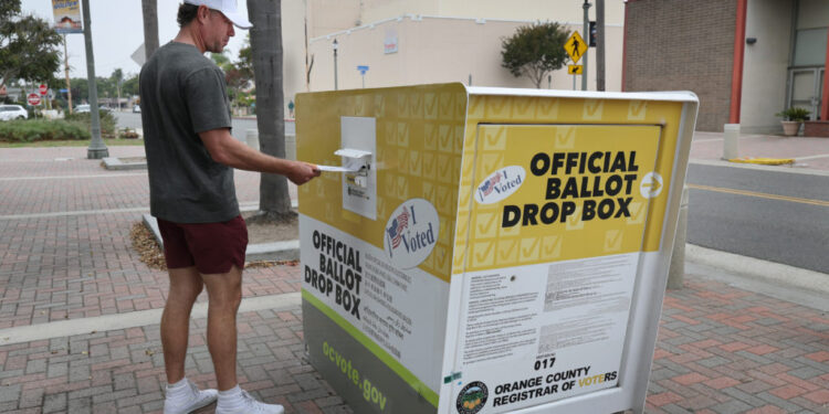 On the first day of early in-person and ballot drop-off voting, voters cast their ballot in the November 4, 2025 Californi...