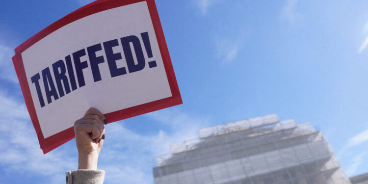 FILE PHOTO: U.S. Supreme Court justices to hear oral arguments on U.S. President Trump's bid to preserve sweeping tariffs,...