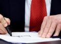 U.S. President Trump signs the funding bill to end the government shutdown, in Washington, D.C.