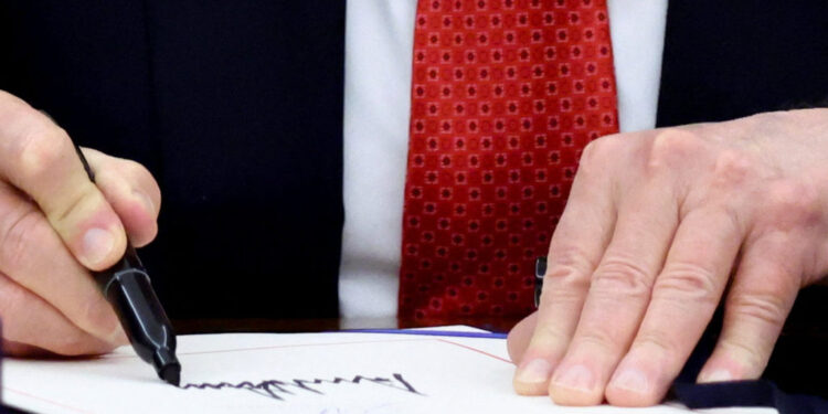 U.S. President Trump signs the funding bill to end the government shutdown, in Washington, D.C.