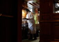 Waitress Mattie Wright serves guests at the Old Ebbitt Grill in Washington