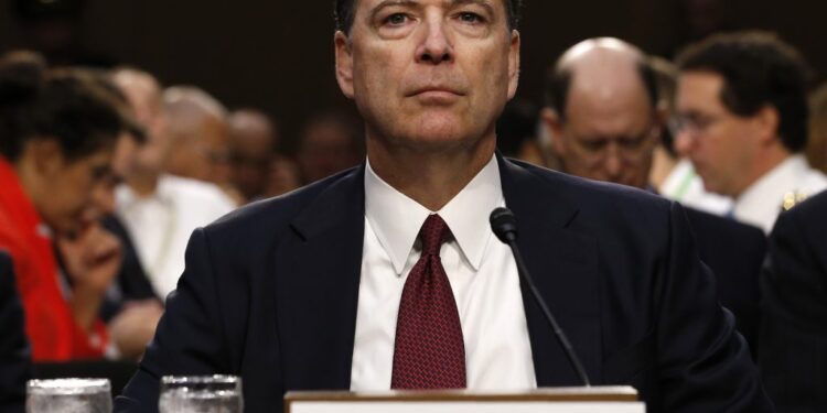 Former FBI Director James Comey testifies at a Senate Intelligence Committee hearing on Russia's alleged interference in t...