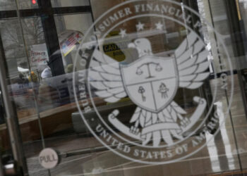 FILE PHOTO: Protest the day after members of Elon Musk's Department of Government Efficiency moved into the CFPB, in Washi...