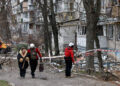 FILE PHOTO: Emergency responders work at the site of a Russian drone strike on an apartment building, in Kyiv