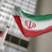 Iranian flag flies in front of the UN office building in Vienna