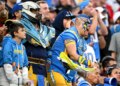 Charger fans cheer during the second half at SoFi Stadium...