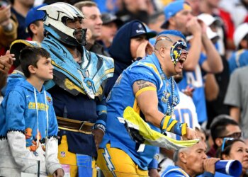 Charger fans cheer during the second half at SoFi Stadium...