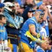 Charger fans cheer during the second half at SoFi Stadium...