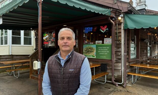 Kevin Colbeck, the owner of Davis' Pub in Eastport, said the street near his business floods about 15 to 20 times per year. (Katharine Wilson/Staff)