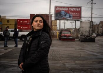 Marimar Martinez outside a truck service shop on Dec. 26, 2025, where she called 911 after she was shot five times in October by a Border Patrol agent in Brighton Park. Prosecutors originally claimed Martinez, as part of a convoy of protesters, rammed federal agents' vehicle near 39th Street and Kedzie Avenue and then tried to run over an agent, but felony charges were later dropped after her attorney argued agents caused the crash and needlessly shot her. (E. Jason Wambsgans/Chicago Tribune)