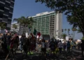 Community members take part in the Dena Protest that started a Pasadena City Hall and walked by four hotels, the Dena Hotel Pasadena, Hilton Pasadena, AC Hotel Pasadena, Westin Hotel Pasadena, in the area that housed ICE officials