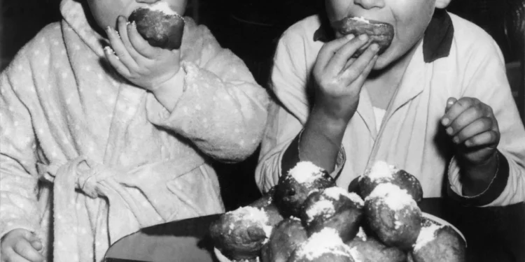 Two Dutch Children Eat Doughnut In 1959
