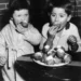 Two Dutch Children Eat Doughnut In 1959
