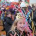 Maisie Holl, 8, of Ellicott City slingsconfetti above her head as the Noon Year's Eve ball drop count, a kid-friendly celebration to ring in 2026 completes at B&O Railroad Museum. (Karl Merton Ferron/Staff)