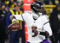 Baltimore Ravens quarterback Tyler Huntley (5) looks to throw against the Green Bay Packers during the first half of an NFL football game, Saturday, Dec. 27, 2025, in Green Bay, Wis. (AP Photo/Mike Roemer)