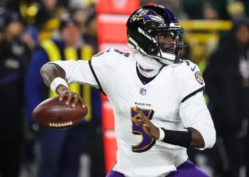 Baltimore Ravens quarterback Tyler Huntley (5) looks to throw against the Green Bay Packers during the first half of an NFL football game, Saturday, Dec. 27, 2025, in Green Bay, Wis. (AP Photo/Mike Roemer)