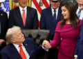 U.S. President Donald Trump signs a bill to award congressional gold medals to members of the 1980 U.S. Olympic men's hock...