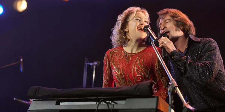 Kate Hudson as Claire Sardina and Hugh Jackman as a husband-and-wife duo in the movie 'Song Sung Blue.'