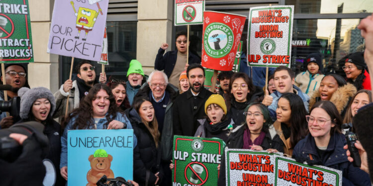 New York City mayor-elect Zohran Mamdani and U.S. Senator Bernie Sanders support striking Starbucks workers in Brooklyn, N...