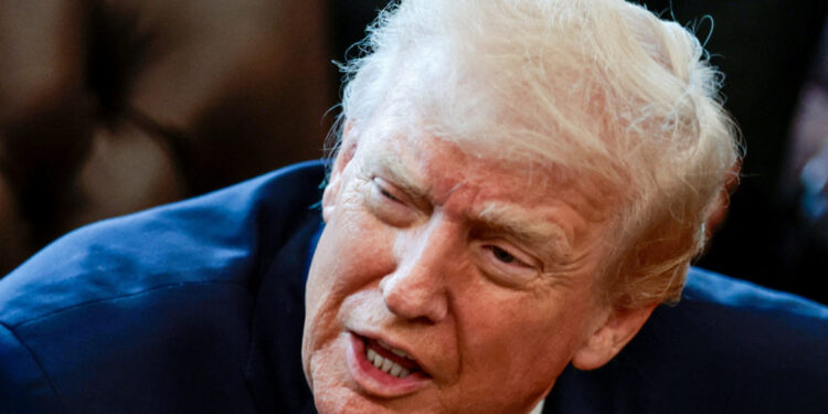 FILE PHOTO: U.S. President Trump signs executive orders at the Oval Office, in Washington