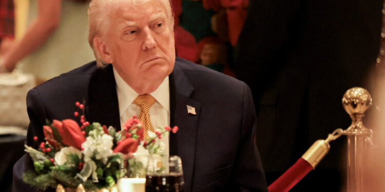 U.S. President Trump takes part in a Christmas Eve dinner in the ballroom of his Mar-a-Lago club in Palm Beach