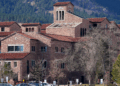 Student walking on campus of University of Colorado Boulder