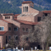 Student walking on campus of University of Colorado Boulder
