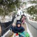 Sledders head to the top of the hill at Barrie Park on Nov. 30, 2025, in Oak Park after the region recorded over 8 inches of snow. (Brian Cassella/Chicago Tribune)