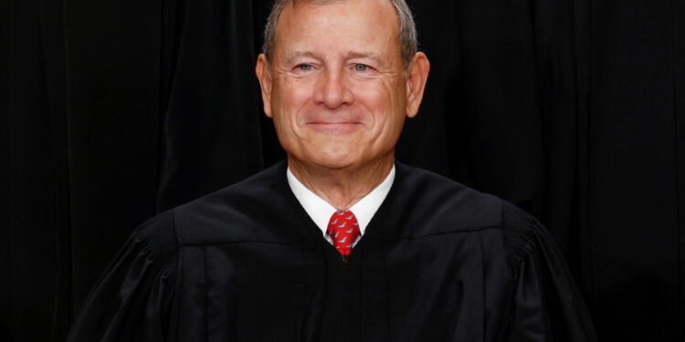 U.S. Supreme Court justices pose for their group portrait at the Supreme Court in Washington