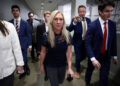 U.S. Representative Marjorie Taylor Greene (R-GA) walks to her final vote, surrounded by staff, in Washington