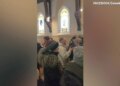 Anti-ICE protesters inside a church