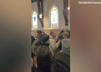 Anti-ICE protesters inside a church