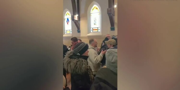 Anti-ICE protesters inside a church
