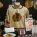A jersey worn by goaltender Glenn Hall in the late 1950s sits on display at the Blackhawks Convention on July 16, 2016 at the Hilton Chicago. (Michael Tercha/Chicago Tribune)