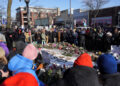 Makeshift memorial at the site where Alex Pretti was fatally shot by federal immigration agents, in Minneapolis