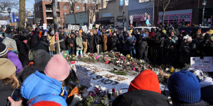 Makeshift memorial at the site where Alex Pretti was fatally shot by federal immigration agents, in Minneapolis