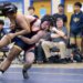 Dulaneyâs Roger Sacks pulls Biehmo Chai to the mat during...