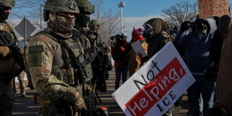 Demonstration against increased immigration enforcement, after a U.S. Immigration and Customs Enforcement (ICE) agent fata...