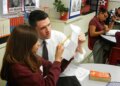 State Rep. and U.S. Senate candidate James Talarico works with a student at Jeremiah Rhodes Middle School in San Antonio, where he taught between 2011-13.