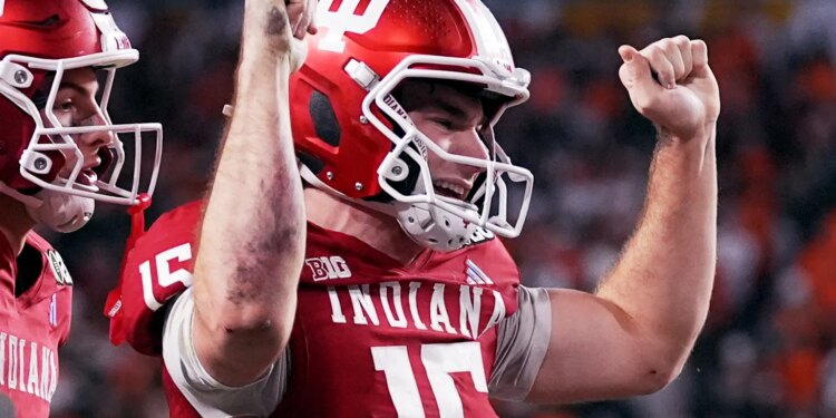 Indiana quarterback Fernando Mendoza celebrates after scoring against Miami during the second half of the College Football Playoff national championship game, Monday, Jan. 19, 2026, in Miami Gardens, Fla. (AP Photo/Marta Lavandier)