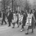 Marchers wear signs that read 'Honor King: End Racism!' and 'Union Justice Now' as they participate in the Sanitation Workers march, soon after the assassination of Dr. Martin Luther King, Jr., Memphis, Tenn., April 1968.