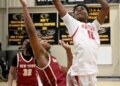Edmondsonâs Nayshawn Williams takes a shot as New Townâs Mekiye...